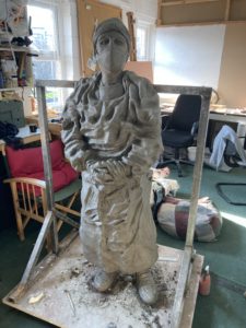 sculpture of a nurse in protective clothing