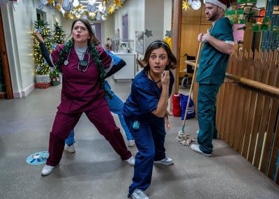 Three actors in medical scrubs