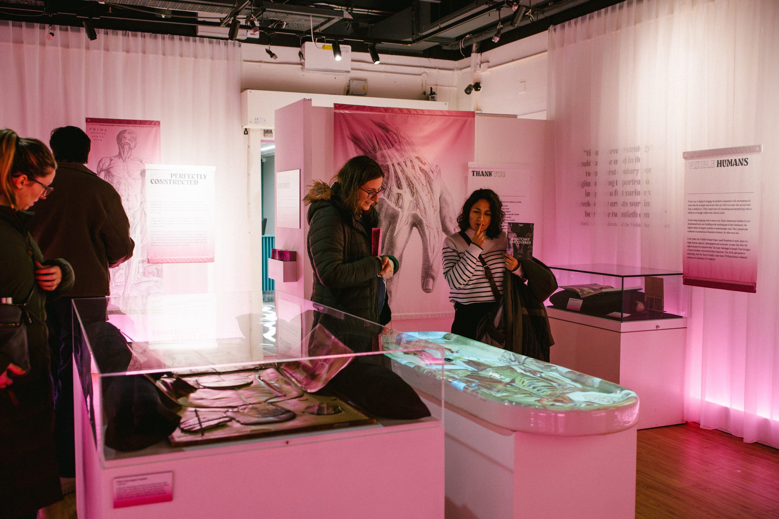 Guests look at exhibition display